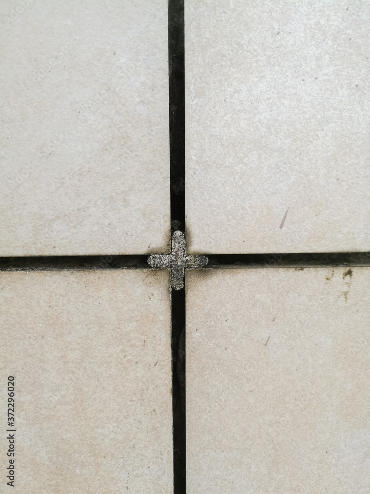 Fototapeta premium Tile texture work done on walls using tiles and spacers between.