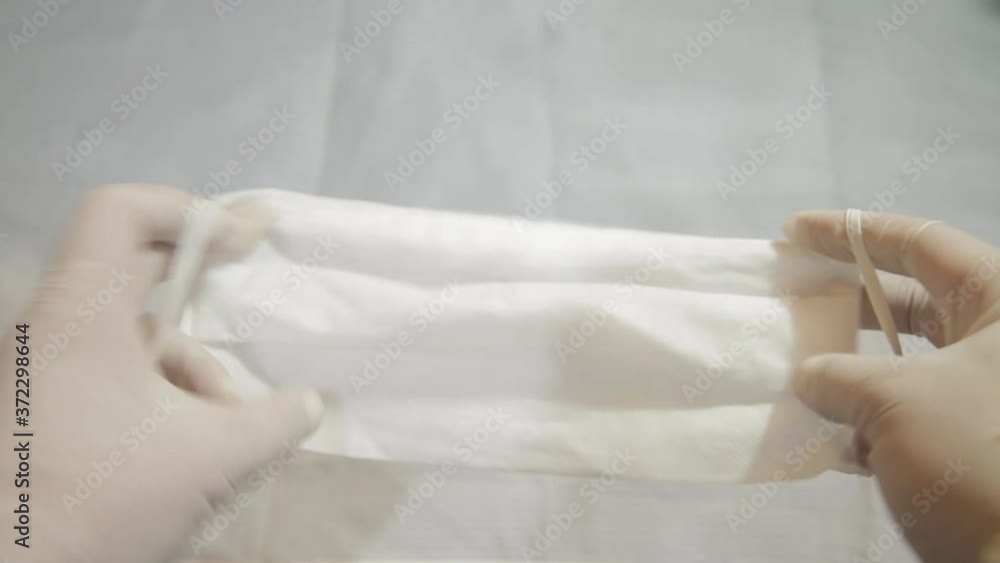 Putting the mask on to prevent coronavirus in the pandemic period in quarantine. 
First person view