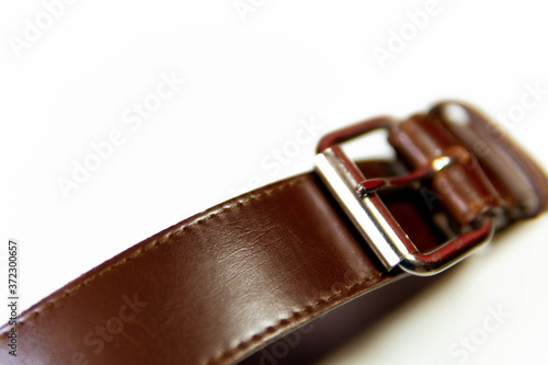 Brown leather belt, with metal buckle, lifestyle, fashion 