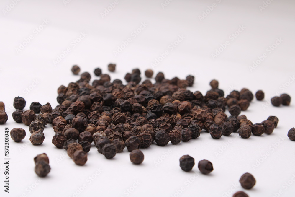 Black pepper placed on a white background. Black pepper placed on a white background.
