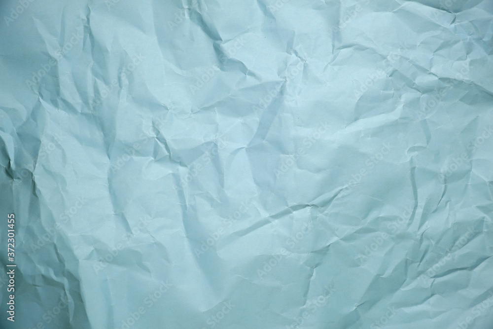 Fototapeta premium Close up of green crumpled empty sheet of paper.