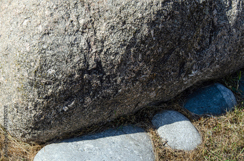 Photos surface of the cave rock wall. gray stone texture background.