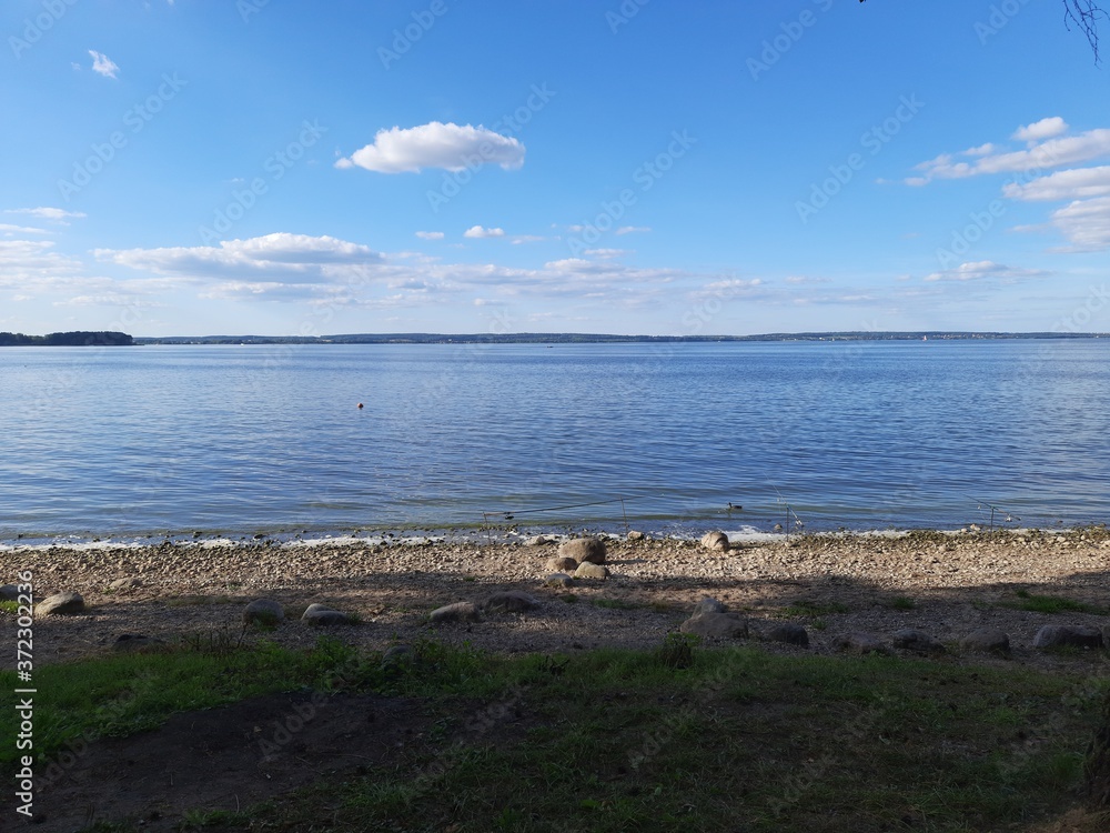 Baltic Sea shore in summertime with fishing rods Baltic Sea shore in summertime with fishing rods