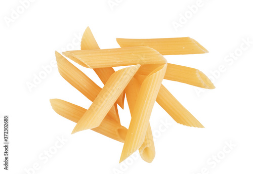 Heap of traditional Italian penne pasta isolated on a white background. Raw organic penne rigate pasta. Italian Cuisine. Beautiful uncooked dried penne. Top view. Copy space.