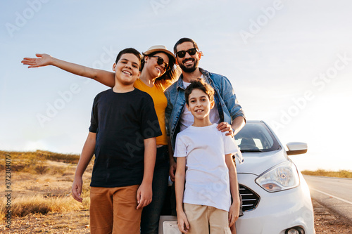 Photos Family road trip. Latin family traveling locally by car.