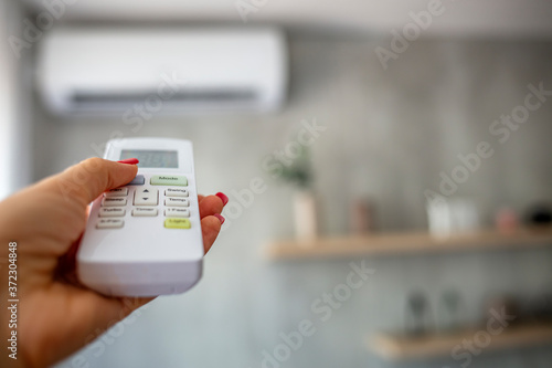 Lowering and Turning Off Air Conditioning to Conserve Eletricity Energy. Use the Remote Control to Turn On the Air Conditioner. 