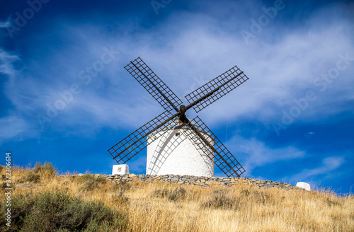 Photo of some beautiful and historic windmills located in Consuegra  Toledo  Spain during a sunny day of summer in a natural place. 