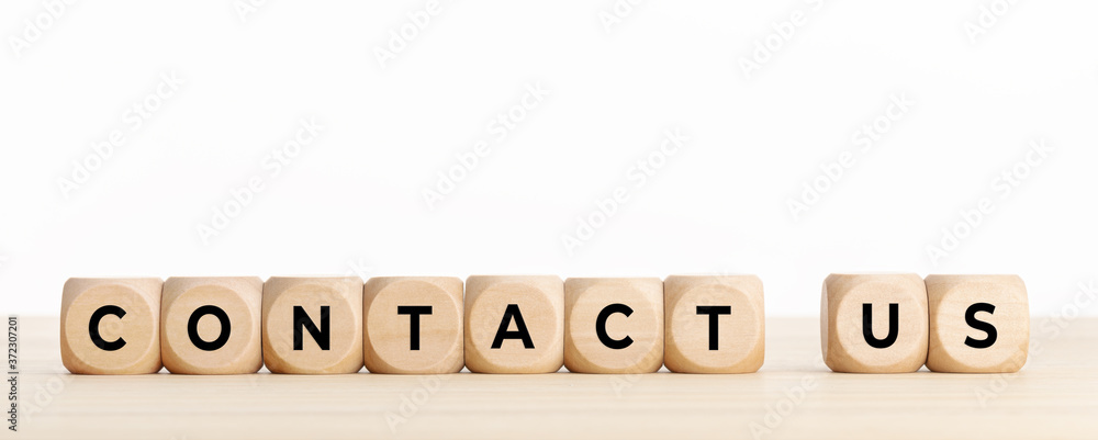 Contact us concept banner. Wooden blocks with text on desk. Copy space Contact us concept banner. Wooden blocks with text on desk. Copy space