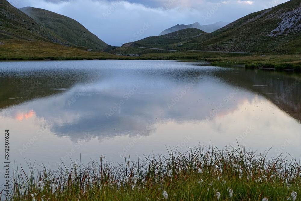 Reflections on a mountain lake at dusk