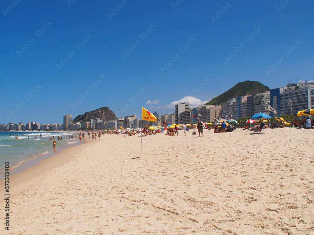 Rio de Janeiro, Brazil - 03/09/2020: sunny day on the coast of the Atlantic ocean, Copacabana beach. Copy space for text.