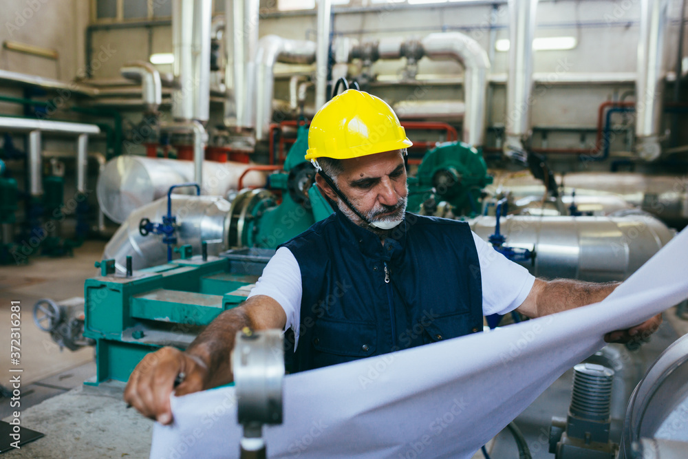 worker in protective equipment working indoor in industry plant worker in protective equipment working indoor in industry plant