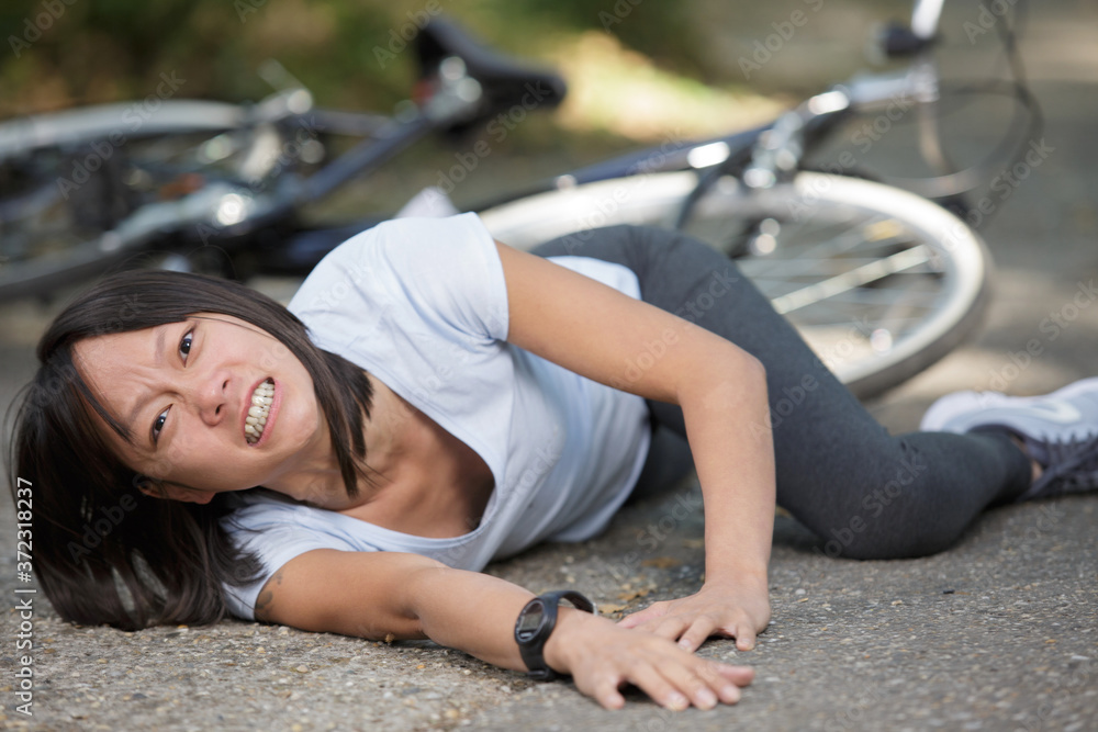 woman in pain after a bike fall