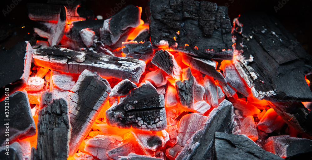 Burning coals in the grill. Fire for cooking. Summer cooking methods. For presentation of outdoor recreation Burning coals in the grill. Fire for cooking. Summer cooking methods. For presentation of outdoor recreation