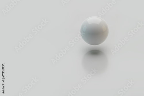 3d ball levitates in the air with a shadow on a white background.