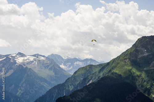 Beautiful mountain view with paragliding 