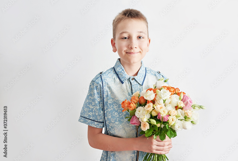 Child boy with bouquet of flowers. Mother's Day Greeting Card. Happy mothers day frame background. Spring card template. Happy Birthday or Valentine. Women's Day. Copy space. Child gives bouquet Child boy with bouquet of flowers. Mother's Day Greeting Card. Happy mothers day frame background. Spring card template. Happy Birthday or Valentine. Women's Day. Copy space. Child gives bouquet