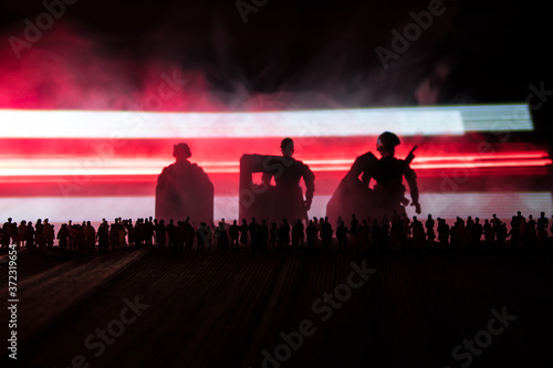 Belarus presidential elections protest symbol flag on dark background. White and red colored light as symbol of Belarus flag. Creative artwork decoration. Crowd in dark. Selective focus photo