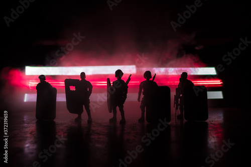 Belarus presidential elections protest symbol flag on dark background. White and red colored light as symbol of Belarus flag. Creative artwork decoration. Crowd in dark. Selective focus photo