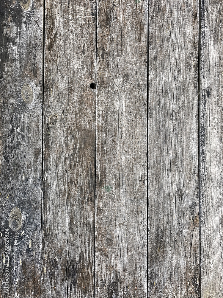 Naklejka premium Vertical shot of the surface of old boards. Unpainted pine tree planks background