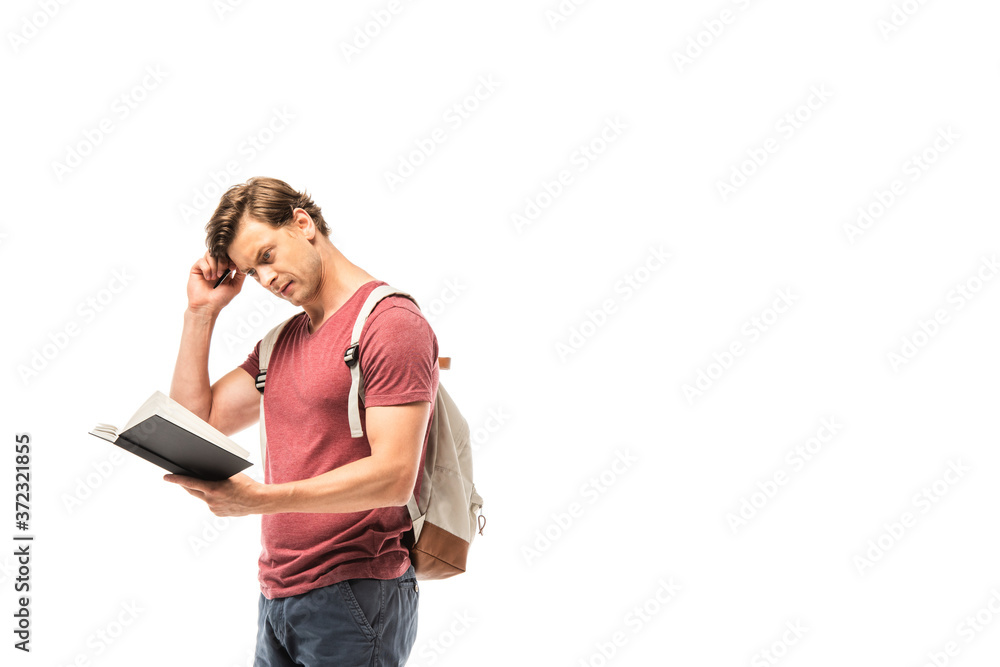 Thoughtful student holding pen and looking at notebook isolated on white Thoughtful student holding pen and looking at notebook isolated on white