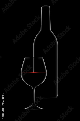 A dramatic rim light outlines a bottle and glass of red wine with light sparkling on the surface of the wine. 