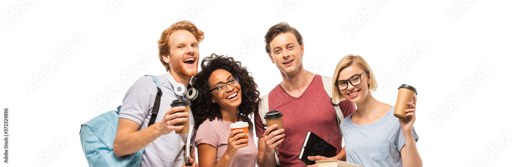 Panoramic shot of multicultural students with coffee to go looking at camera isolated on white Panoramic shot of multicultural students with coffee to go looking at camera isolated on white