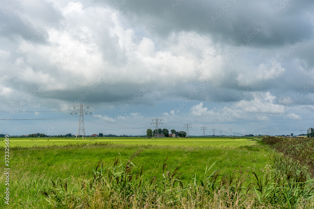 Dark clouds indicating a thunder storm above a rural landscape. Dark clouds indicating a thunder storm above a rural landscape.