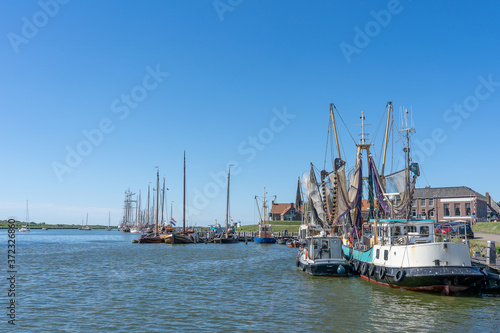 Empty sailboats and pleasure craft are anchored in the water © mikevanschoonderwalt