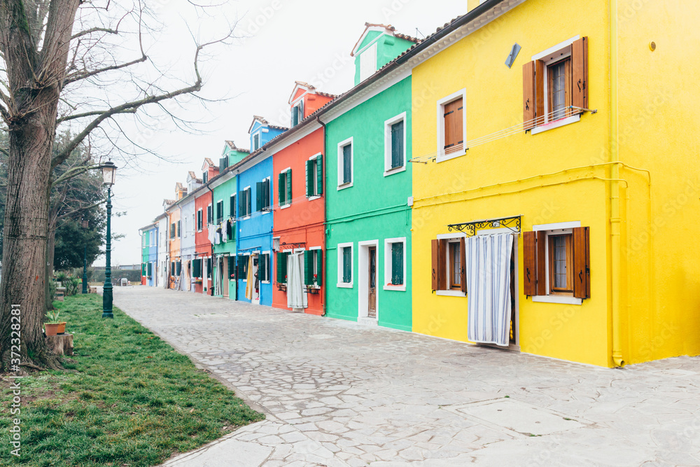 Island of Burano, Venice, Italy. Colored houses. Postcard from Burano on foggy day. Island of Burano, Venice, Italy. Colored houses. Postcard from Burano on foggy day.