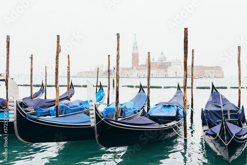 Gondolas moored by Piazza San Marco with the church of San Giorgio di Maggiore in Venice, Italy. © A.J. Pedrosa