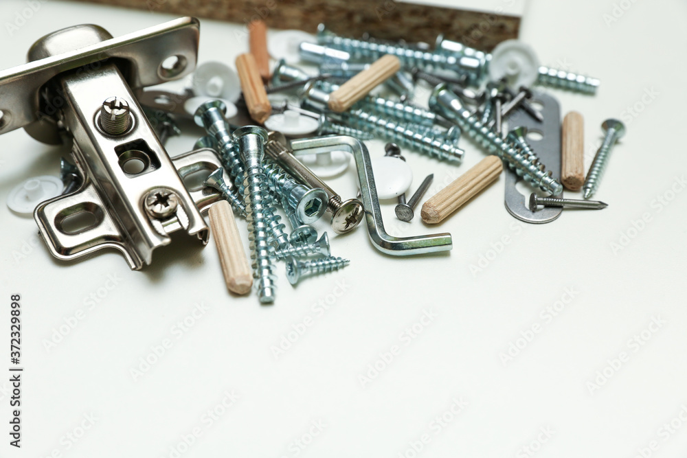 furniture fittings on white background close up. assembling furniture yourself. furniture fittings on white background close up. assembling furniture yourself.