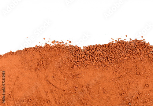 Heap of Red dry clay isolated on white background. Ochre, also spelled ocher, a natural yellow earth pigment. Pile of Red dirt (soil) on white.