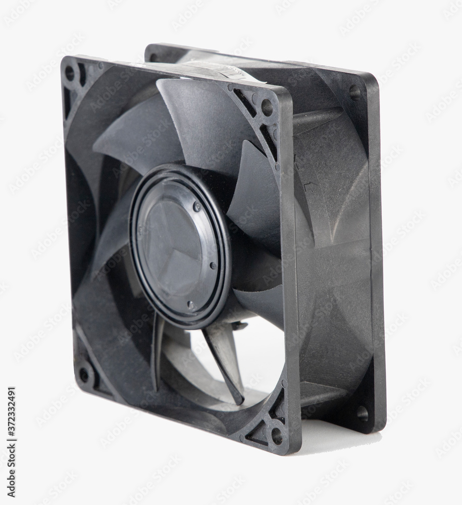 DC brushless fan with 5 volt and 12 volt DC. Mini cooling fan made of black plastic complete with cables on isolated white background.