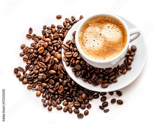 Coffee in a white cup with a saucer and coffee grains on a white background. Isolate