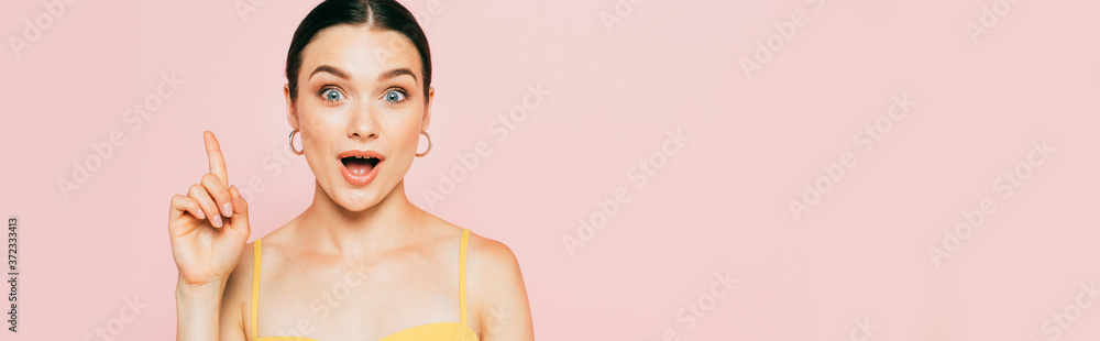 surprised brunette young woman showing idea gesture isolated on pink, panoramic shot surprised brunette young woman showing idea gesture isolated on pink, panoramic shot