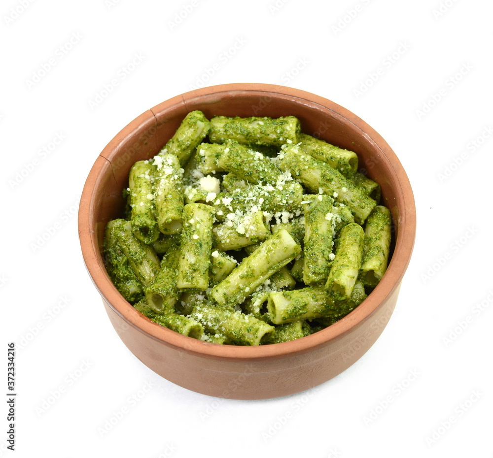 Pasta with original pesto green sauce in Genoa (Genova) Italy on white background, Pasta with basil pesto herbs isolated. Italian Food. Pasta with original pesto green sauce in Genoa (Genova) Italy on white background, Pasta with basil pesto herbs isolated. Italian Food.