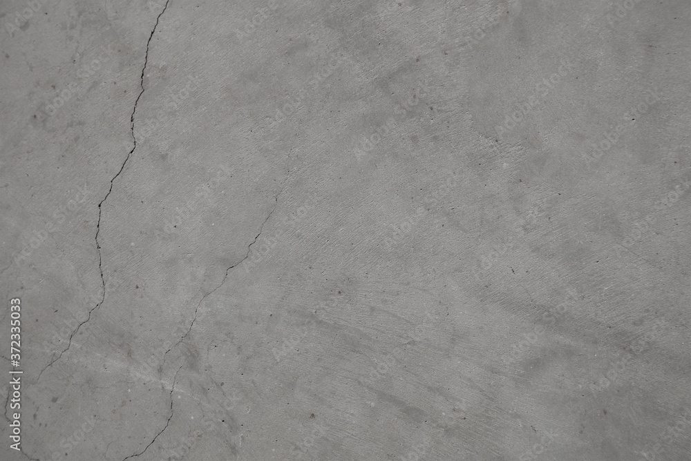 Naklejka premium Beton popękany szary