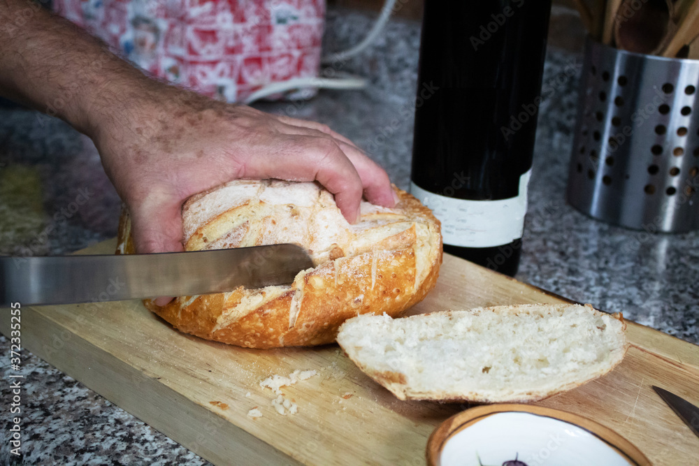 Hand cutting bread Hand cutting bread