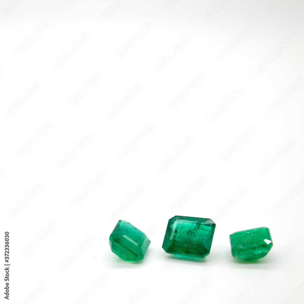 Emerald Loose Gemstones On White Background Emerald Loose Gemstones On White Background
