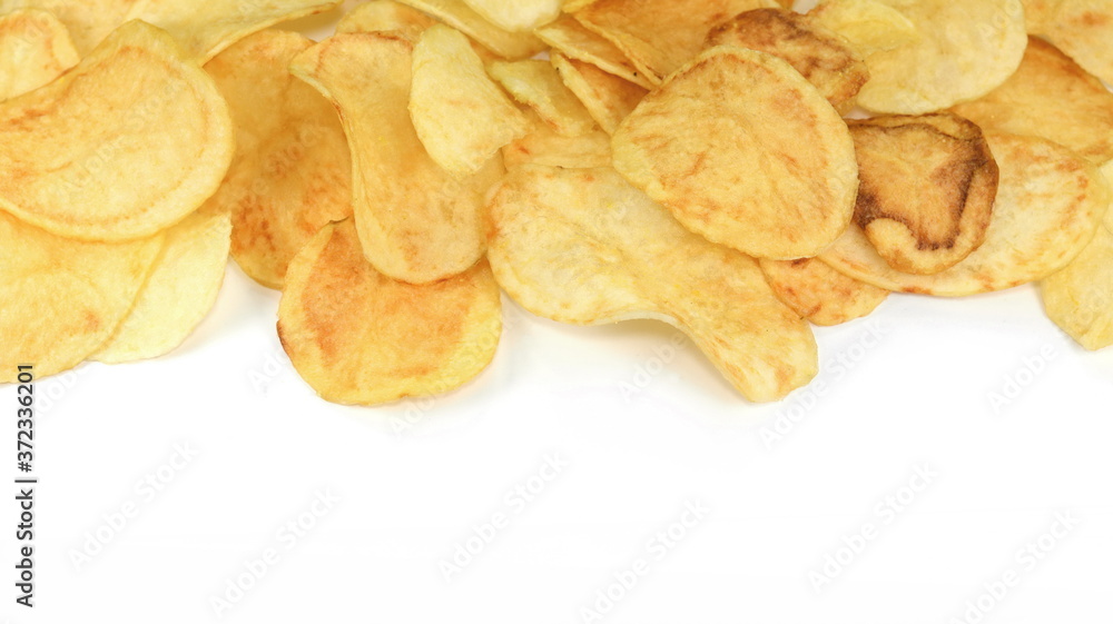 Salty Potato chips isolated on white background.