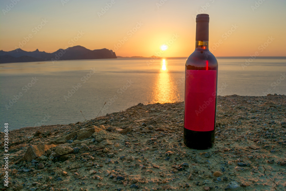 bottle of wine in the background of dawn