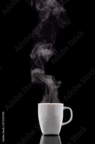 Coffee cup and steam. Freshly brewed coffee in a white ceramic mug.