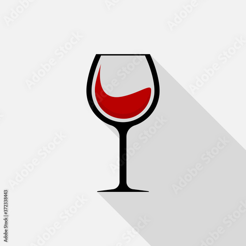 Red wine in glass icon with long shadow on gray background, flat design style