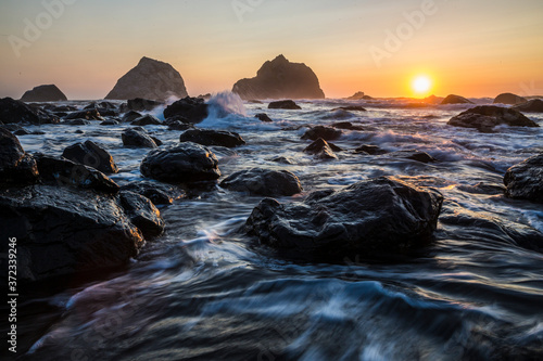 Wallpaper Mural Beautiful sunset with splashing waves on the beach of False Klamath Cove in Redwood National Park (California). Torontodigital.ca