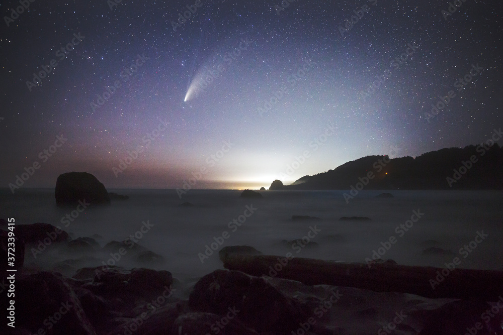 The Comet NEOWISE over the beaches of Redwood National Park in California.