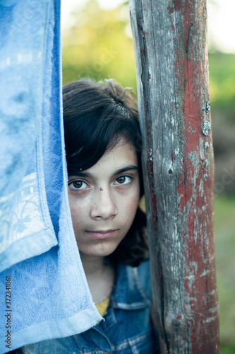 Close-up portrait of a young dark-haired girl. © De Visu