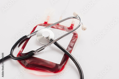 blood donation package with blank label and stethoscope on white