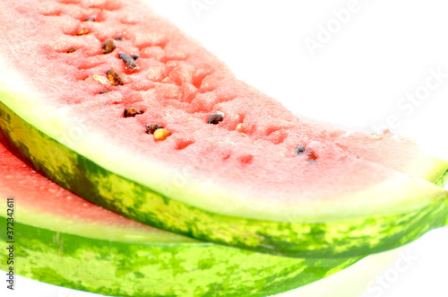 Two slices of watermelon isolated on white, delicious berry