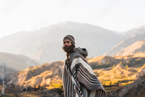 Man in traditional peruvian clothing in nature photo