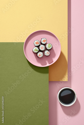 Sushi rolls on a pink plate, Japanese food photo